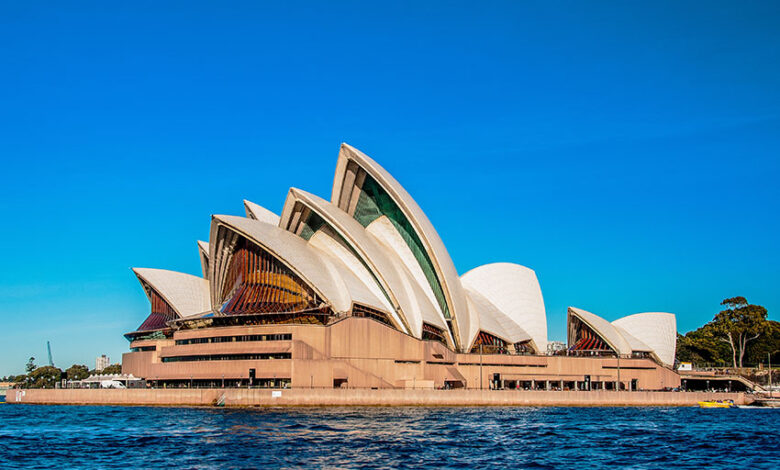 Sydney Opera House near the beautiful sea under the clear blue sky