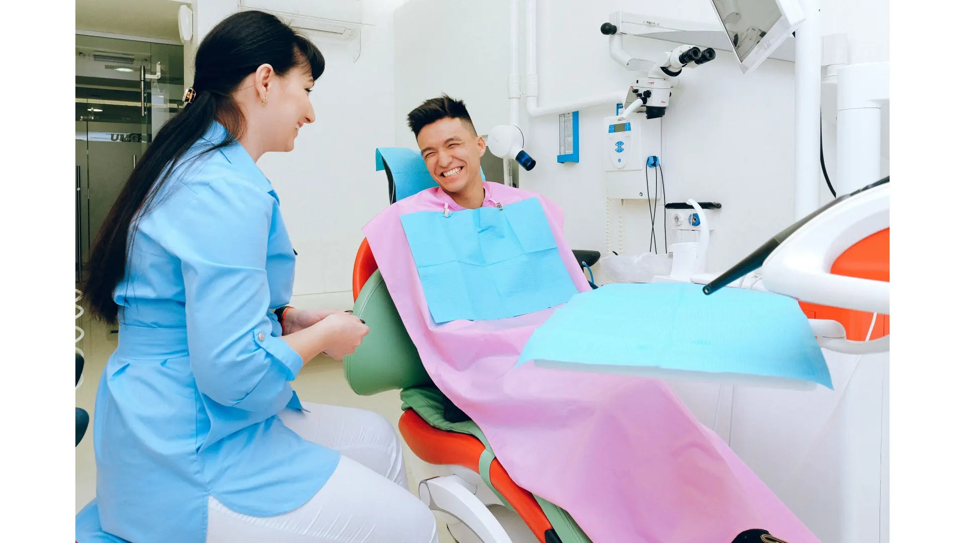 Dentist performing a routine dental check-up for a family